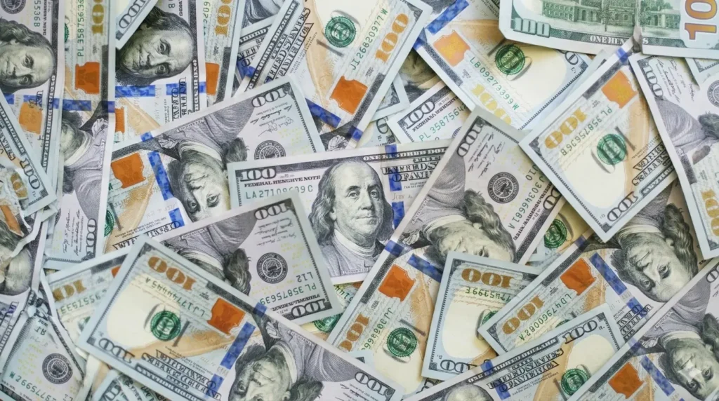 A pile of hundred dollar bills